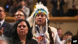 FILE - Lee Juan Tyler of Idaho waits for President Barack Obama to speak at the 2015 White House Tribal Nations Conference, Nov. 5, 2015. Despite the problems facing Native Americans, they rarely are a priority in U.S. presidential elections.