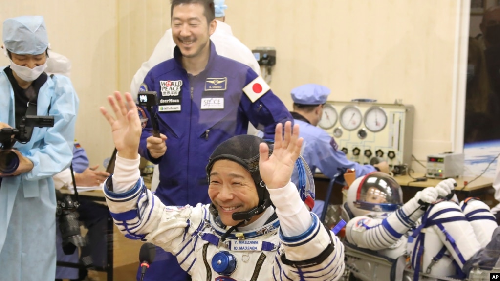 Spaceflight participant Yusaku Maezawa of Japan, member of the main crew of the new Soyuz mission to the International Space Station (ISS) gestures prior the launch at the Russian leased Baikonur cosmodrome, Kazakhstan, Wednesday, Dec. 8, 2021. (Pavel Kas