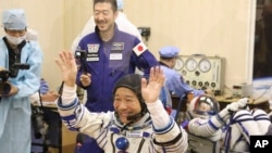 Spaceflight participant Yusaku Maezawa of Japan, member of the main crew of the new Soyuz mission to the International Space Station (ISS) gestures prior the launch at the Russian leased Baikonur cosmodrome, Kazakhstan, Wednesday, Dec. 8, 2021. (Pavel Kas