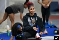 FILE - University of Kentucky track & field athlete Masai Russell during practice at the Nutter Field House in Lexington, Kentucky on Feb. 18, 2022. (AP Photo/Timothy D. Easley)