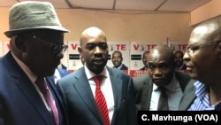FILE: Nelson Chamisa, leader of Movement for Democratic Change Alliance, talks to Tendai Biti and other senior members of the alliance at the party’s headquarters ahead of Zimbabwe’s July 30 general election.