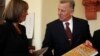 Hungary's President Pal Schmitt shows a special edition of the new constitution to Zsuzsanna Miko (L), director of the National Archives of Hungary, in Budapest, Jan. 5, 2012. 