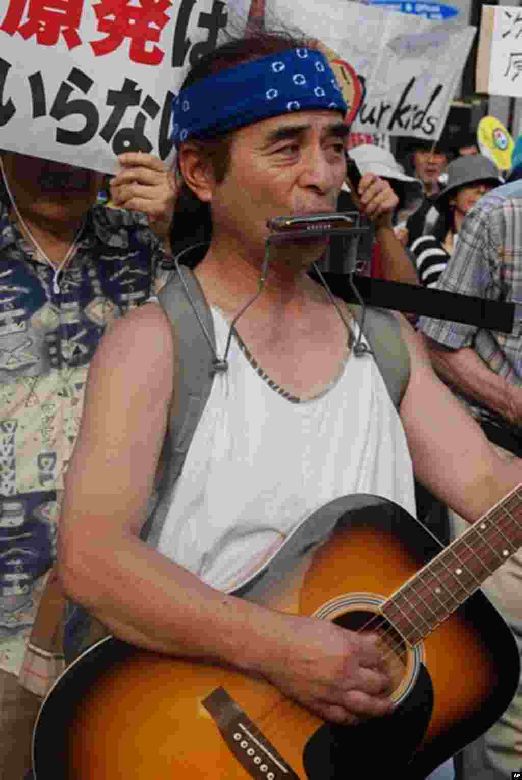 One musical participant in Monday's march through the streets of the Shibuya district in Tokyo.