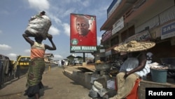 A poster shows John Dramani Mahama, Ghana's interim president and National Democratic Congress (NDC) presidential candidate, on a street in Accra, December 2, 2012.
