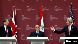 From left, Britain's Foreign Secretary Philip Hammond, Iraq's Prime Minister Haider al-Abadi and U.S. Secretary of State John Kerry attend a press conference at the Foreign and Commonwealth Office in London, Jan. 22, 2015. 