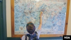 An Austrian tourist marks her path on a map in Williams, Arizona