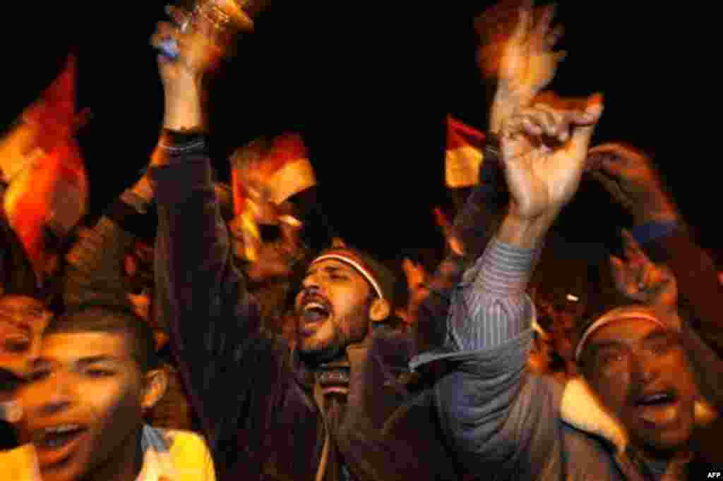 Egyptians celebrate after President Hosni Mubarak resigned and handed power to the military at Tahrir Square, in Cairo, Egypt, Friday, Feb. 11, 2011. Egypt exploded with joy, tears, and relief after pro-democracy protesters brought down President Hosni Mu