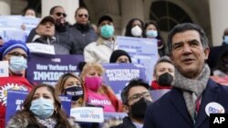 FILE - New York City Council Member Ydanis Rodriguez speaks during a rally on the steps of City Hall ahead of a City Council vote to allow lawful permanent residents to cast votes in elections to pick the mayor, City Council members and other municipal of