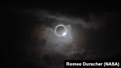 FILE - A total solar eclipse seen from the northern tip of Australia, Nov. 13, 2012.