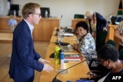 FILE - uMngeni municipality mayor and KwaZulu Natal premier candidate, Chris Pappas (L), attends a city council meeting in Howick on January 31, 2024.