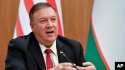FILE - U.S. Secretary of State Mike Pompeo speaks during a news conference in Tashkent, Uzbekistan, Feb. 3, 2020. He spoke Feb. 8 to a National Governors Association meeting in Washington.