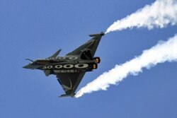 FILE - A Dassault Rafale fighter jet takes part in a flying display at the Le Bourget airport near Paris in this June 2011 file photo.