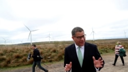 FILE - COP26 President Alok Sharma attends an event at Whitelee Windfarm, outside Glasgow, Scotland, May 14, 2021.