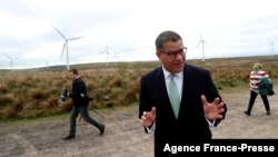 FILE - COP26 President Alok Sharma attends an event at Whitelee Windfarm, outside Glasgow, Scotland, May 14, 2021. 