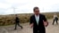 FILE - COP26 President Alok Sharma attends an event at Whitelee Windfarm, outside Glasgow, Scotland, May 14, 2021. 