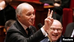 French Foreign Minister Laurent Fabius says preliminary climate talks have laid promising groundwork for a U.N. summit in three weeks. He's shown at the National Assembly in Paris, Nov. 10, 2015.