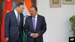 Indian National Security Adviser Ajit Doval (R) talks with Chinese State Councillor Yang Jiechi before their delegation-level meeting in New Delhi, India, Dec. 22, 2017.