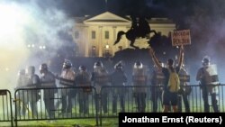 Police in riot gear keep protesters away from the White House May 31, 2020. (REUTERS/Jonathan Ernst)