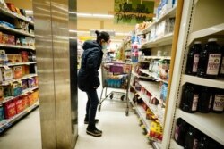 New Yorkers wear protective masks and strip store shelves of supplies as the coronavirus continues to wreak havoc throughout the city, Mar 13, 2020.