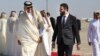 A photo released by the official Syrian Arab News Agency on Jan. 30, 2025, shows Qatar's Emir Sheikh Tamim bin Hamad Al Thani, left, welcomed by Syria's interim president Ahmed al-Sharaa, upon his arrival in Damascus. (AFP PHOTO/HO/SANA) 