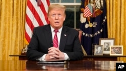 President Donald Trump speaks from the Oval Office of the White House as he gives a prime-time address about border security, Jan. 8, 2018, in Washington. 