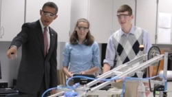 President Obama with students Meghan Clark and Nathan Hughes and a robot last month at Thomas Jefferson High School for Science and Technology in Alexandria, Virginia