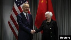 U.S. Treasury Secretary Janet Yellen shakes hands with Chinese Vice Premier Liu He as they meet for talks in Zurich, Switzerland, Jan., 18, 2023. 