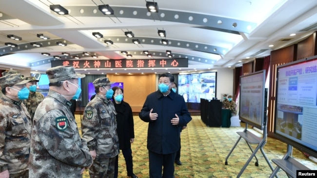 Chinese President Xi Jinping learns about the hospital's operations, treatment of patients, protection for medical workers and scientific research in Wuhan, the epicentre of the novel coronavirus outbreak, Hubei province, China, March 10, 2020.
