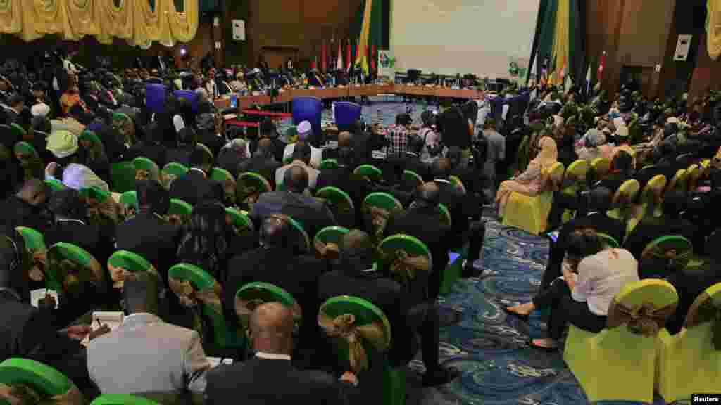 Participants attend a session of the 43rd ECOWAS meeting in Abuja July 17, 2013.