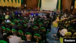 Participants attend a session of the 43rd ECOWAS meeting in Abuja July 17, 2013.