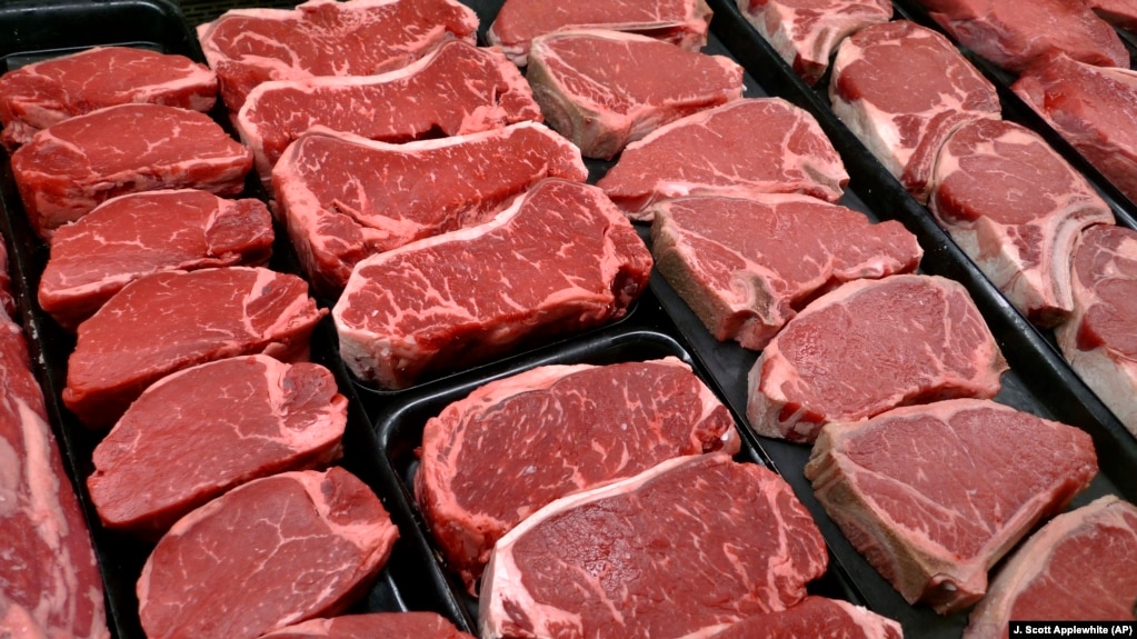 FILE - New U.S. food guidelines suggest eating less red meat and more beans, vegetables and healthy fats. In this Jan. 18, 2010 file photo, beef products are for sale at a food store in McLean, Virginia. (AP Photo/J. Scott Applewhite)