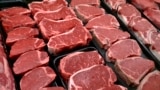 FILE - New U.S. food guidelines suggest eating less red meat and more beans, vegetables and healthy fats. In this Jan. 18, 2010 file photo, beef products are for sale at a food store in McLean, Virginia. (AP Photo/J. Scott Applewhite)