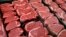 FILE - New U.S. food guidelines suggest eating less red meat and more beans, vegetables and healthy fats. In this Jan. 18, 2010 file photo, beef products are for sale at a food store in McLean, Virginia. (AP Photo/J. Scott Applewhite)