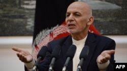 FILE - Afghan President Mohammad Ashraf Ghani speaks during a press conference at Presidential Palace in Kabul, June 30, 2018. 