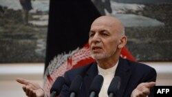 FILE - Afghan president Mohammad Ashraf Ghani speaks during a press conference at Presidential Palace in Kabul on June 30, 2018. 