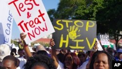 FILE: Civil rights activists march in Durban, South Africa, Monday, July 18, 2016, at the start of the 21st World Aids Conference. 