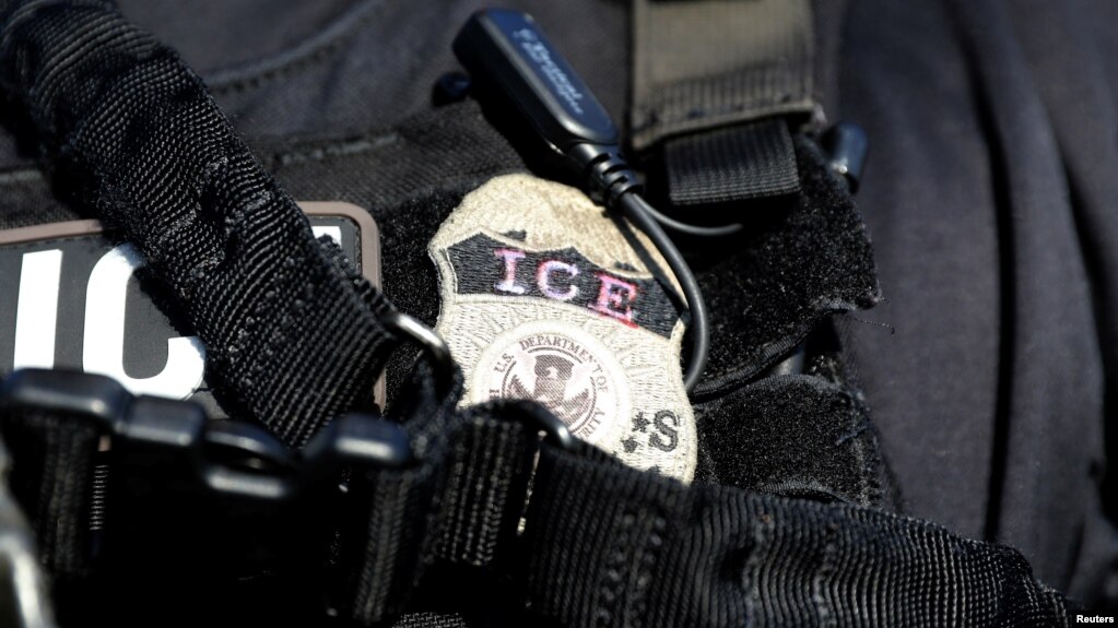 FILE - A U.S. Immigration and Customs Enforcement badge.