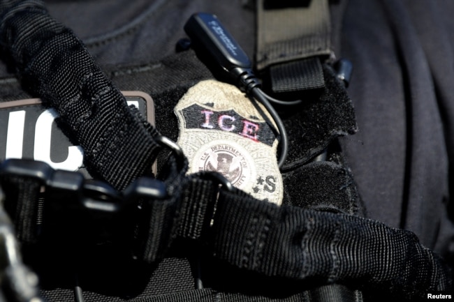 FILE - A U.S. Immigration and Customs Enforcement badge.