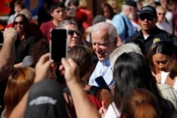 Democratic presidential candidate former Vice President Joe Biden meets with people at a campaign event, Sept. 27, 2019, in Las Vegas.