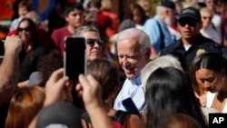 Democratic presidential candidate former Vice President Joe Biden meets with people at a campaign event, Sept. 27, 2019, in Las Vegas.