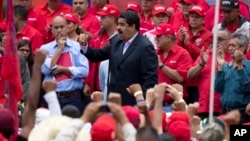 Venezuela's President Nicolas Maduro speaks to oil workers during a demonstration outside Miraflores Presidential Palace after he met with U.S. diplomat Thomas Shannon in Caracas, Venezuela, June 22, 2016.