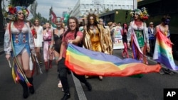 People take part in the annual Pride parade in Kiev, Ukraine, June 23, 2019. 