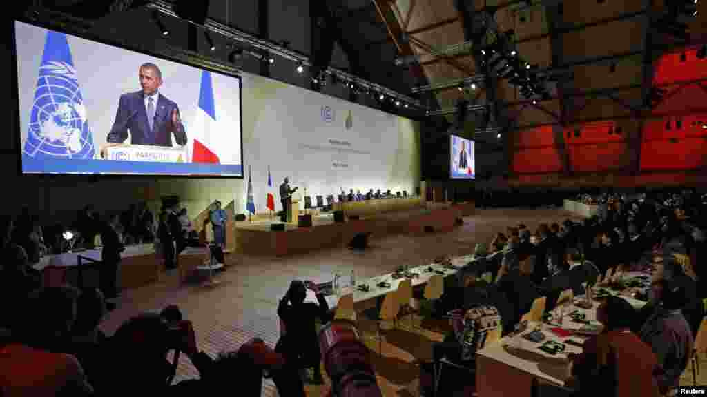 U.S. President Barack Obama is seen on a giant screen as he delivers a speech for the opening day of the World Climate Change Conference 2015 (COP21) at Le Bourget, near Paris, France, November 30, 2015. 