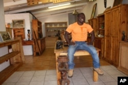 Donkor's been making furniture since he was 14 years of age, but all his attention is now on Ghana's attempt to reach the World Cup semifinals
