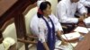 Burma's opposition leader Aung San Suu Kyi asks a question during a regular session of the parliament at Burma's Lower House, July 25, 2012, in Naypyitaw.