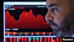 A Trader works at his station on the floor at the New York Stock Exchange (NYSE) in New York, US, May 13, 2019.