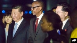 FILE - Rwandan President Paul Kagame, center, greets Chinese President Xi Jinping, center left, in Kigali, Rwanda, on July 22, 2018.