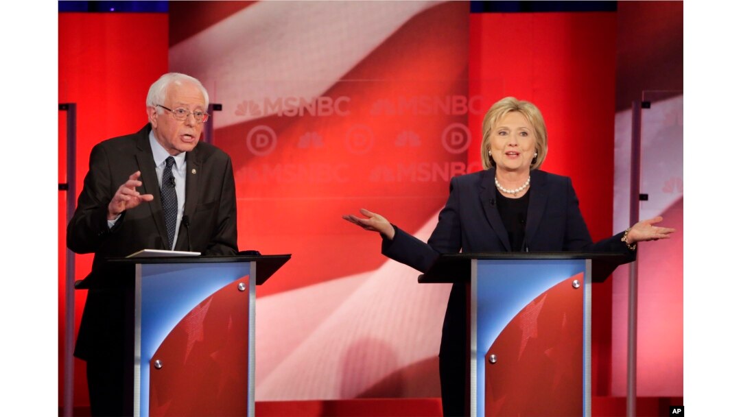 Democratic presidential candidate Senator Bernie Sanders listens to a point made by rival candidate Hillary Clinton during a presidential primary debate hosted by MSNBC in Durham, N.H., Feb. 4, 2016.