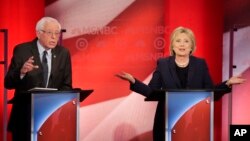 Democratic presidential candidate Senator Bernie Sanders listens to a point made by rival candidate Hillary Clinton during a presidential primary debate hosted by MSNBC in Durham, N.H., Feb. 4, 2016.