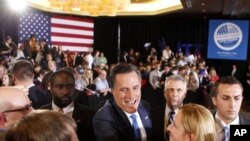 Republican presidential candidate, former Massachusetts Gov. Mitt Romney, greets supporters at his Super Tuesday primary party in Boston, March 6, 2012.